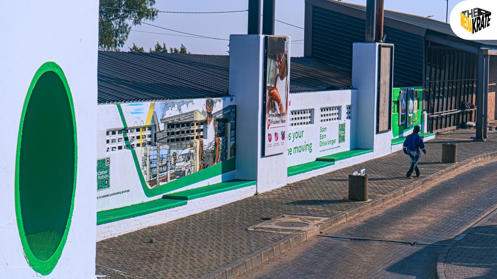 Street-side wall with Castrol and fibre branding