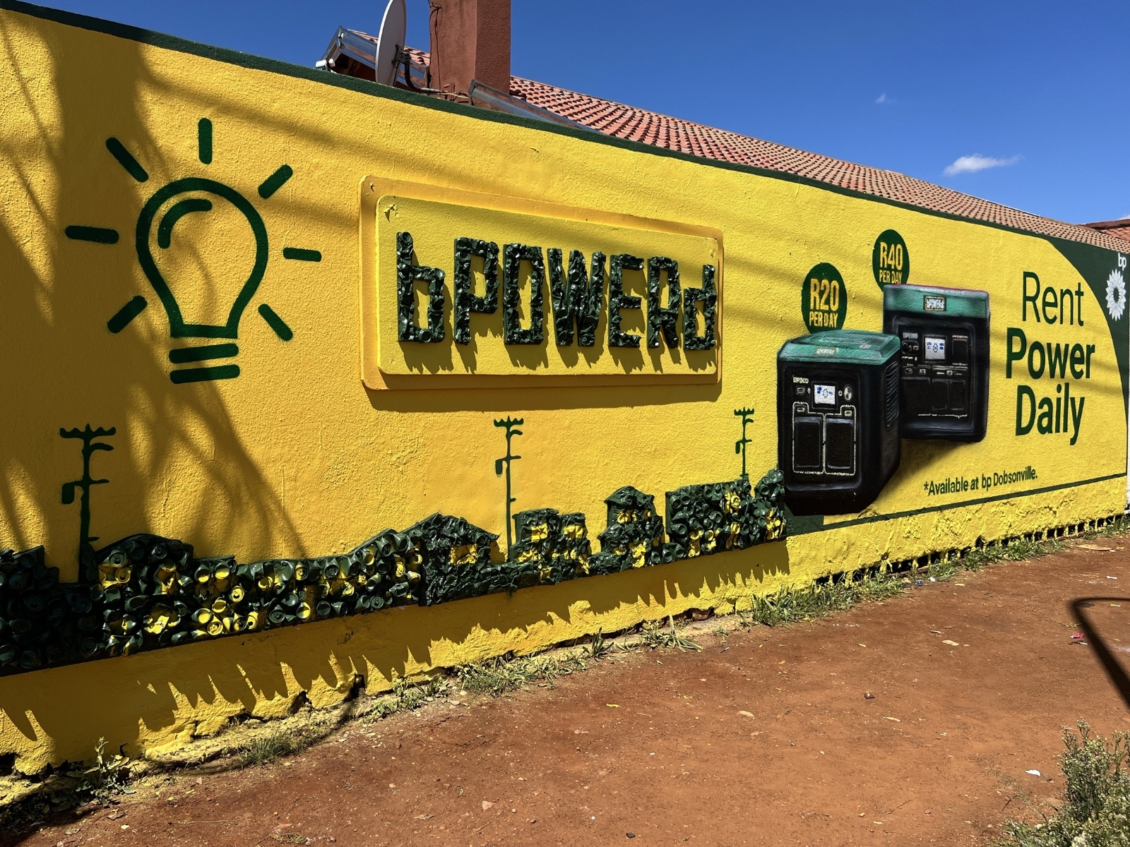 BP Powerd yellow mural with 3D generator and lightbulb